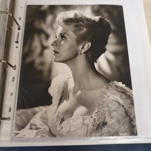 27 - An album of 1930s and 1950s film portrait photographs, and lobby cards, to include Joan Marion, Andr... 