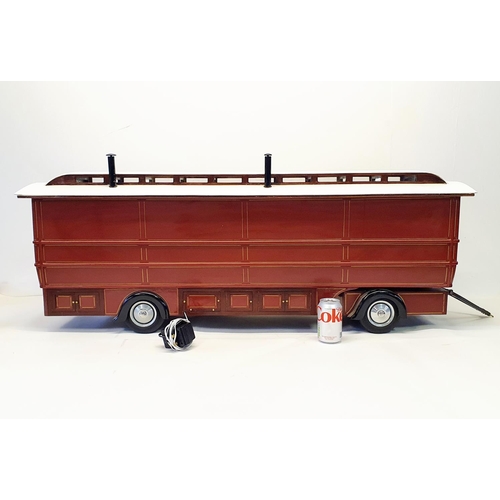 66 - A scratch built model of a fairground living wagon, 127 cm wide  
Provenance: Hand built by the vend... 