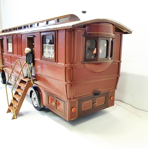 66 - A scratch built model of a fairground living wagon, 127 cm wide  
Provenance: Hand built by the vend... 