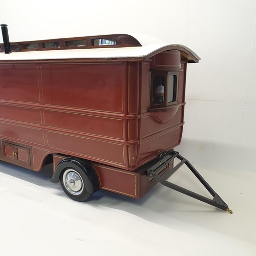 66 - A scratch built model of a fairground living wagon, 127 cm wide  
Provenance: Hand built by the vend... 