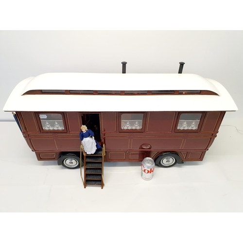 67 - A scratch built model of a fairground living wagon, 100 cm wide
Provenance:  Hand built by the vendo... 