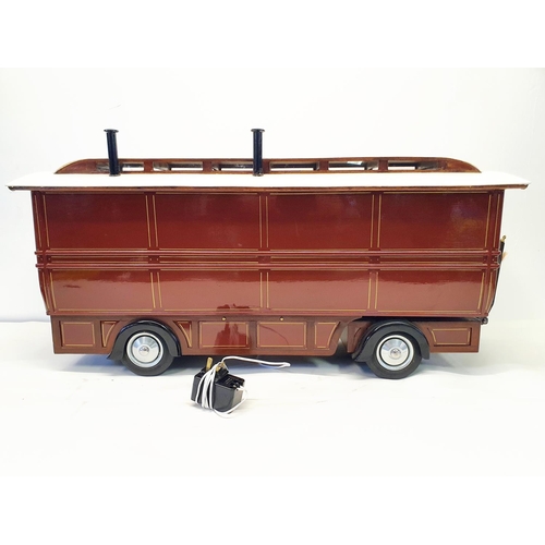 67 - A scratch built model of a fairground living wagon, 100 cm wide
Provenance:  Hand built by the vendo... 