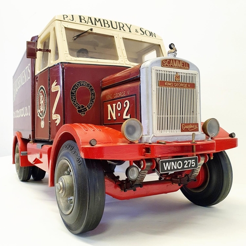 68 - A scratch built model of a Scammell lorry, branded P J Bambury & Son, Amusements, 60 cm wide, and a ... 