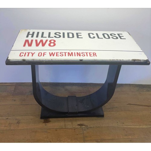 101 - An enamel street sign, Hillside Close NW8, City of Westminster, set into the top of a table, 107 cm ... 