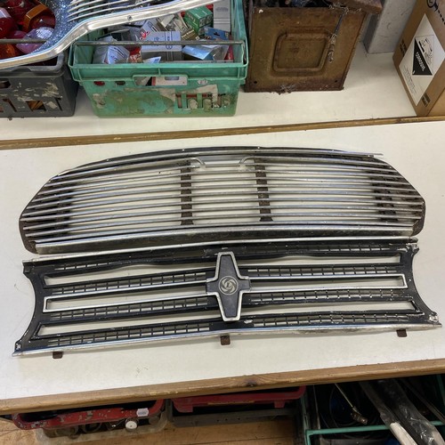 158 - A Ford Escort Mk I front grill, and two other front grills (3)