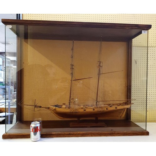 70 - A model of a two masted schooner, in a display case, 103 cm wide 
Provenance:  Hand built by the ven... 