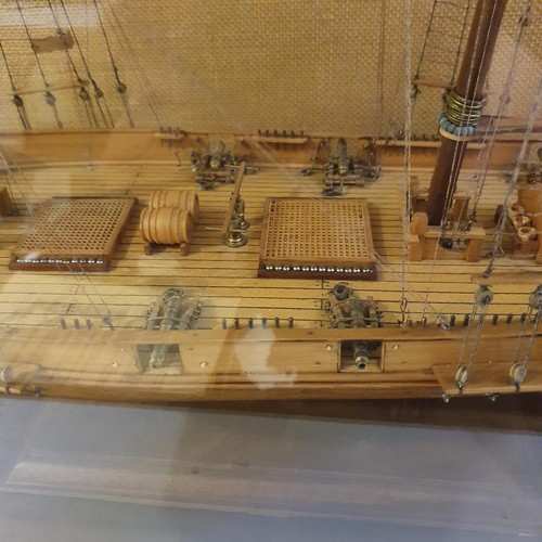 70 - A model of a two masted schooner, in a display case, 103 cm wide 
Provenance:  Hand built by the ven... 