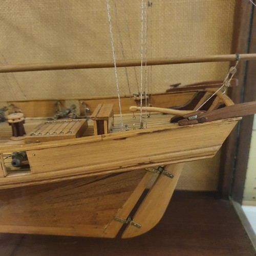 70 - A model of a two masted schooner, in a display case, 103 cm wide 
Provenance:  Hand built by the ven... 