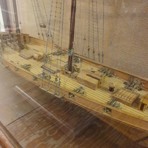 70 - A model of a two masted schooner, in a display case, 103 cm wide 
Provenance:  Hand built by the ven... 