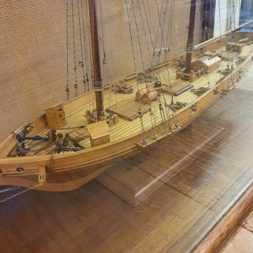 70 - A model of a two masted schooner, in a display case, 103 cm wide 
Provenance:  Hand built by the ven... 