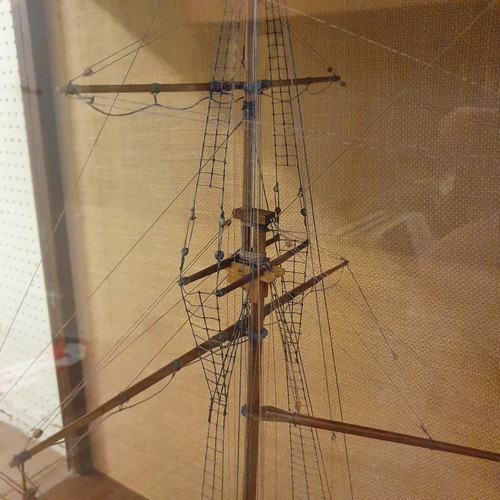 70 - A model of a two masted schooner, in a display case, 103 cm wide 
Provenance:  Hand built by the ven... 