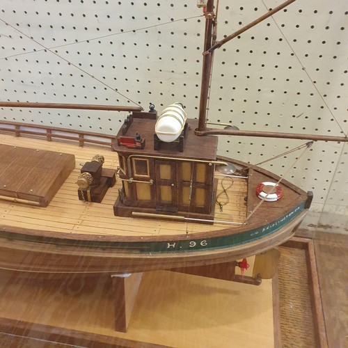 71 - A model of a trawler, Eileen, in a display case, 80 cm wide 
Provenance:  Hand built by the vendor