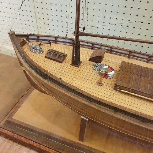 71 - A model of a trawler, Eileen, in a display case, 80 cm wide 
Provenance:  Hand built by the vendor