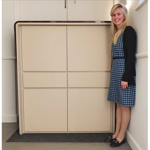 133 - A Bentley Home Eastgate cocktail cabinet, in burr walnut and cream leather, comprising two cupboard ... 