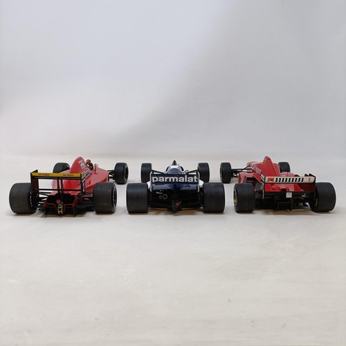 94 - A Grand Prix model of Michael Schumacher's Ferrari F1 Car, and two others (3)