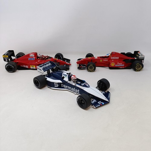 94 - A Grand Prix model of Michael Schumacher's Ferrari F1 Car, and two others (3)