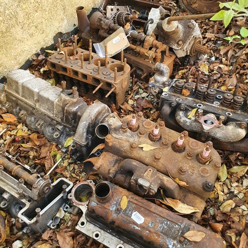 241 - Assorted cylinder heads and other engine parts, including Austin 7  (qty)
Provenance: Removed from a... 