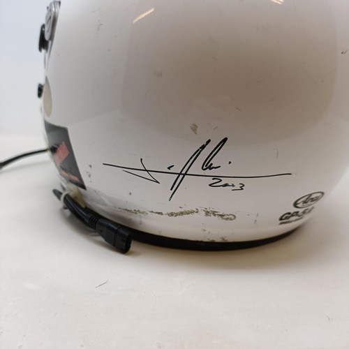 104 - An Arai Motor Racing helmet, signed by Michael Schumacher and Jean Alessi, dated 2003