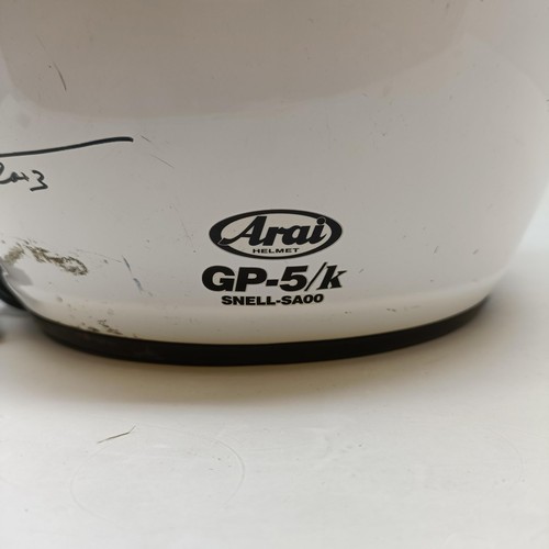 104 - An Arai Motor Racing helmet, signed by Michael Schumacher and Jean Alessi, dated 2003