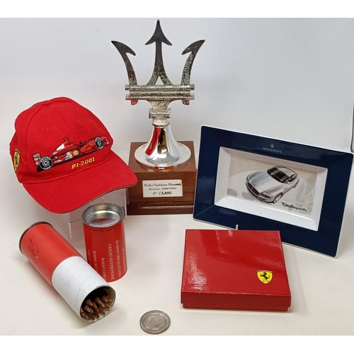 99 - A Tiffany & Co silver Heads and Tails Coin, a Ferrari cap, a set of Ferrari Car Colour Pencils, a Ma... 