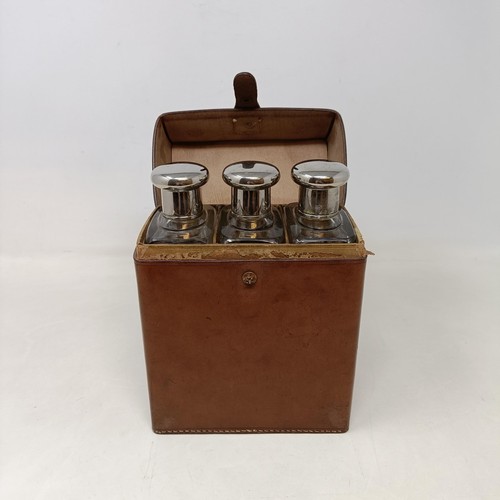 152 - A fine leather cased set of glass drinks bottles, c.1910