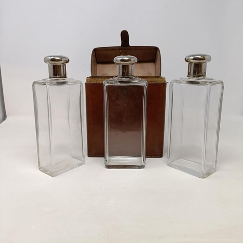 152 - A fine leather cased set of glass drinks bottles, c.1910