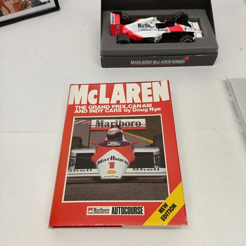 108 - Assorted Ayrton Senna memorabilia, to include a McLaren book signed by Ayrton Senna, a model of a Mc... 