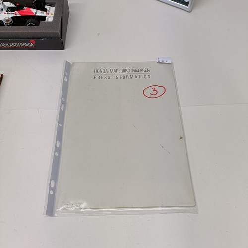 108 - Assorted Ayrton Senna memorabilia, to include a McLaren book signed by Ayrton Senna, a model of a Mc... 