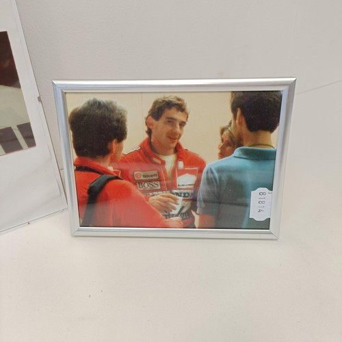 108 - Assorted Ayrton Senna memorabilia, to include a McLaren book signed by Ayrton Senna, a model of a Mc... 