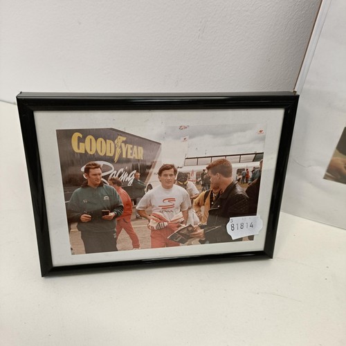 108 - Assorted Ayrton Senna memorabilia, to include a McLaren book signed by Ayrton Senna, a model of a Mc... 