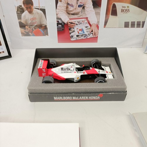 108 - Assorted Ayrton Senna memorabilia, to include a McLaren book signed by Ayrton Senna, a model of a Mc... 