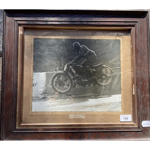 139 - A monochrome photograph, Noel Christmas leaping Ballig Bridge, during the 1933 Manx Grand Prix, 25 x... 