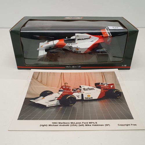 115 - A Paul's Model Art 1:18 scale model of a McLaren MP4/11, driven by Mika Hakkinen, boxed, and a photo... 