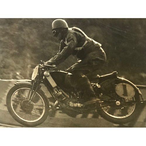 139 - A monochrome photograph, Noel Christmas leaping Ballig Bridge, during the 1933 Manx Grand Prix, 25 x... 