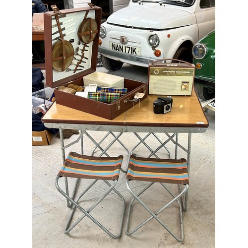 94 - A retro folding picnic table, four folding seats, a picnic hamper, a camera and a Philips radio, all... 