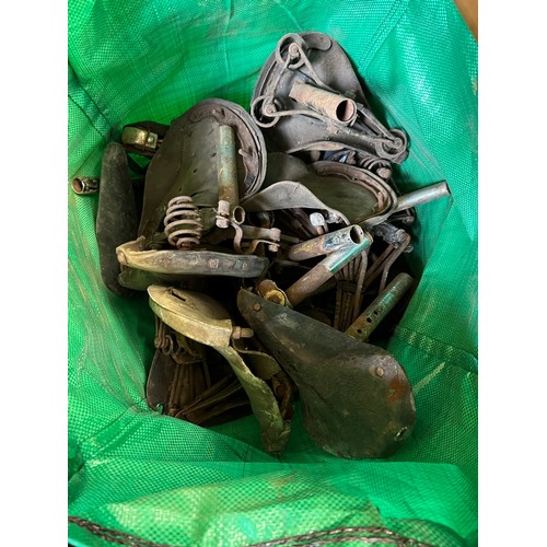 213 - Assorted motorcycle and bicycle seats, and assorted bicycle parts (qty)  
Provenance: Removed from a... 