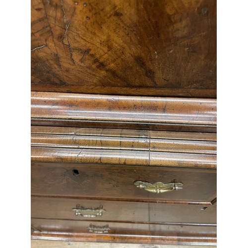 481 - An 18th century walnut cabinet on chest, with two cupboard doors, to reveal an interior with drawers... 