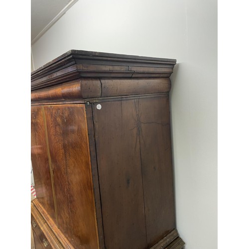 481 - An 18th century walnut cabinet on chest, with two cupboard doors, to reveal an interior with drawers... 