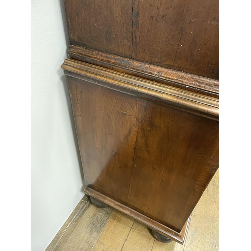 481 - An 18th century walnut cabinet on chest, with two cupboard doors, to reveal an interior with drawers... 