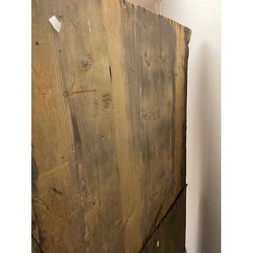 481 - An 18th century walnut cabinet on chest, with two cupboard doors, to reveal an interior with drawers... 