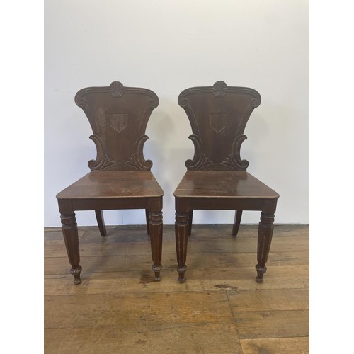 530 - A pair of 19th century mahogany hall chairs (2)