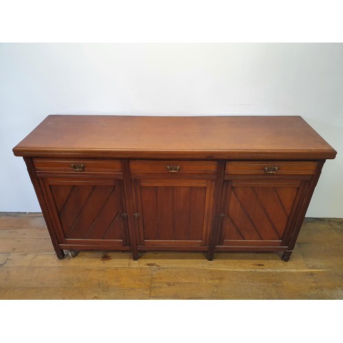 562 - A walnut sideboard, 180 cm wide, and a walnut side table, 73 cm wide, and a carved oak stool (3)