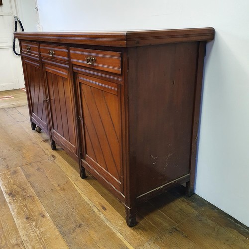 562 - A walnut sideboard, 180 cm wide, and a walnut side table, 73 cm wide, and a carved oak stool (3)