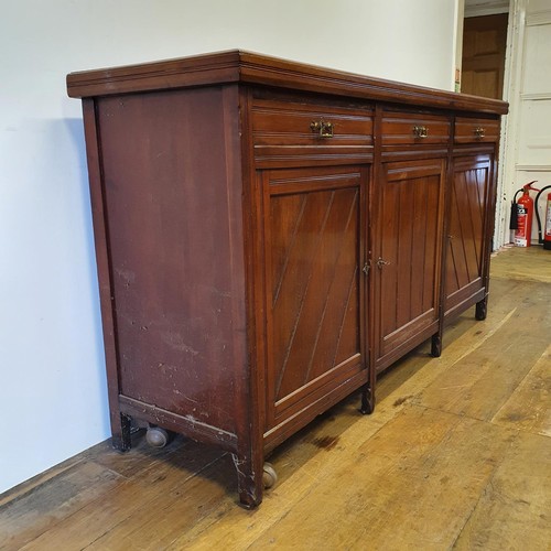 562 - A walnut sideboard, 180 cm wide, and a walnut side table, 73 cm wide, and a carved oak stool (3)