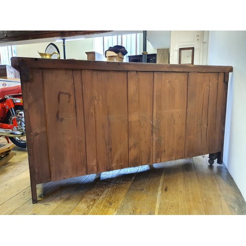 562 - A walnut sideboard, 180 cm wide, and a walnut side table, 73 cm wide, and a carved oak stool (3)