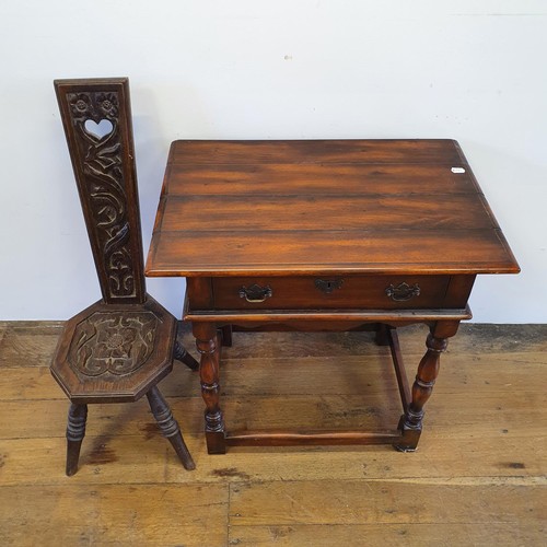 562 - A walnut sideboard, 180 cm wide, and a walnut side table, 73 cm wide, and a carved oak stool (3)