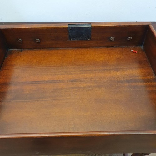 562 - A walnut sideboard, 180 cm wide, and a walnut side table, 73 cm wide, and a carved oak stool (3)