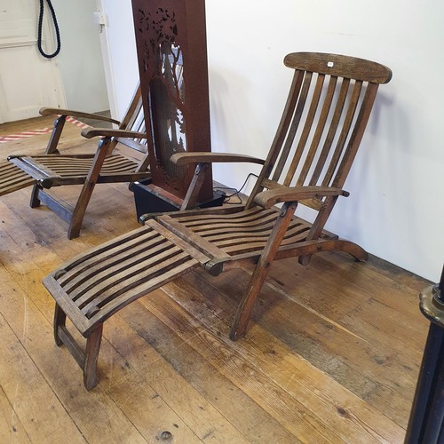 604 - A pair of teak folding garden steamer chairs, and a modern water feature (3)