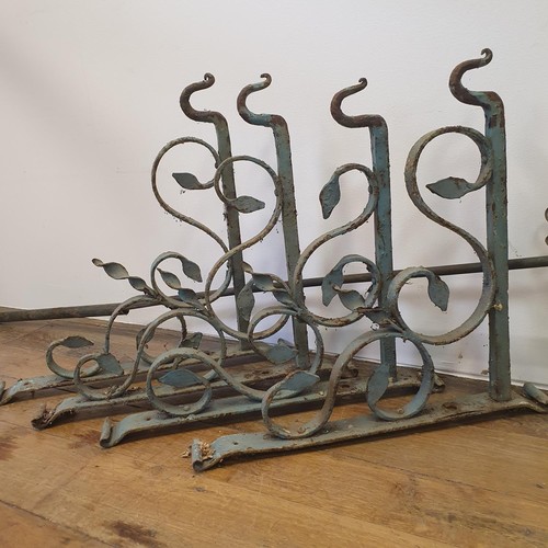 612 - A set of four wrought iron wall hooks, 60 cm wide and a part of a gas standard lamp 170 cm high (5)