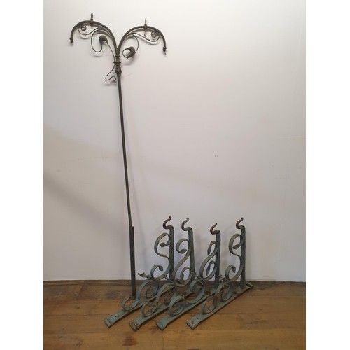 612 - A set of four wrought iron wall hooks, 60 cm wide and a part of a gas standard lamp 170 cm high (5)